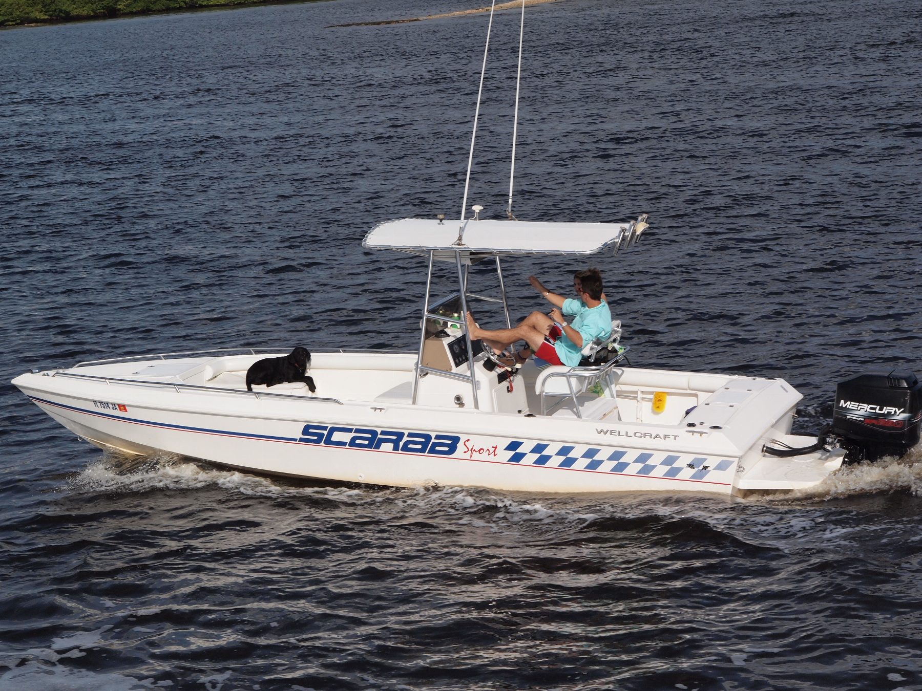 Exterior deck of a Wellcraft yacht overlooking the Mauritian lagoon